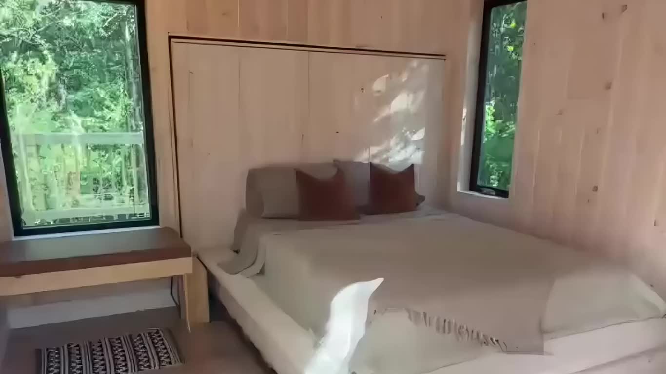 Aurora's bed rolling out through the opened end wall toward the forest